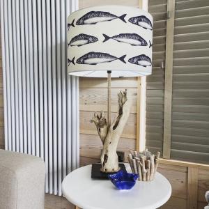 a lamp with fish on it on a table at 7 Piran View, Padstow in Padstow