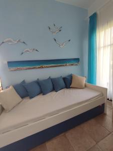 Postel nebo postele na pokoji v ubytování Sea Art House