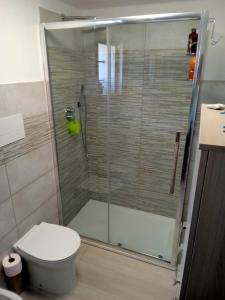 a bathroom with a shower with a toilet at Casa Turchese-Colline Costa Smeralda in Olbia +10 photos