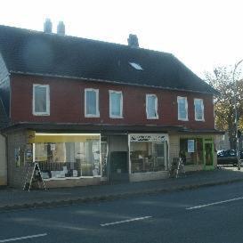 a large red building on the side of a street at Gästehaus Harz -Monteurzimmervermietung- in Vienenburg