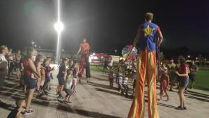 a crowd of people standing on a sidewalk at night at BBBB Resort Apartman Zalakaros in Zalakaros +43 photos
