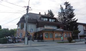a group of people standing outside of a building at BBBB Resort Apartman Zalakaros in Zalakaros