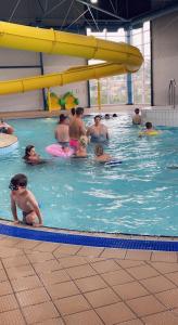 a group of people in a swimming pool at B23 in Goodrington