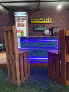 a drink bar with a cooler in a restaurant at The Hood - Shkodra Backpackers Hostel in Shkodër