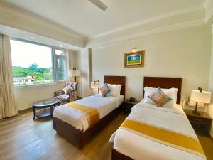 Green View by Green Tree Hotels客房内的一张或多张床位