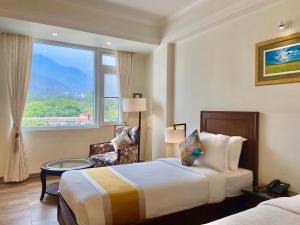 Green View by Green Tree Hotels客房内的一张或多张床位