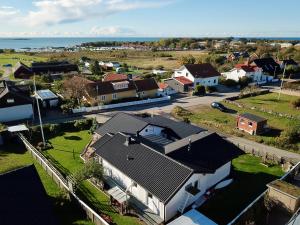 an aerial view of a village with houses and the ocean at Gustavsro i Apelviken Annex 2 in Varberg