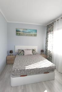 A bed or beds in a room at Apartamento Club Paraíso con vista Teide y Mar