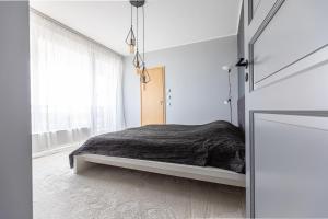 A bed or beds in a room at Aida top floor Apartment