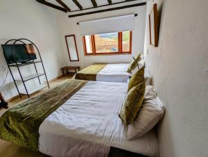 A bed or beds in a room at Casa de Huéspedes Faletto
