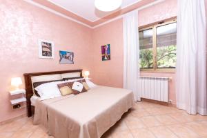Postel nebo postele na pokoji v ubytování Villetta indipendente vicino aeroporto