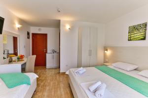 Ένα ή περισσότερα κρεβάτια σε δωμάτιο στο Villa Skyprime +52 φωτογραφίες