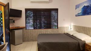 Rúm í herbergi á Sunrise Club Hotel