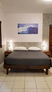 Rúm í herbergi á Sunrise Club Hotel