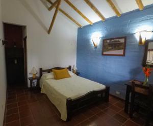 Postel nebo postele na pokoji v ubytování Finca Hotel La Quinta Porra