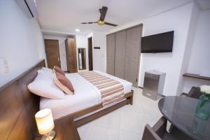 Hotel Ribera Sinu的电视和/或娱乐中心