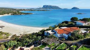 an aerial view of a beach with a house at Beach House Rebe in Golfo Aranci