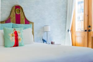 Postel nebo postele na pokoji v ubytování La Concordia - Boutique Hotel