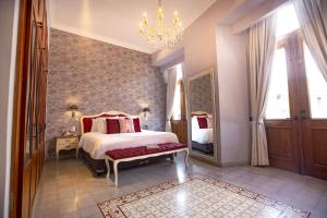 Postel nebo postele na pokoji v ubytování La Concordia - Boutique Hotel