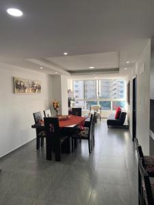 a dining room with a table and chairs at Kattyapartament 303 Salinas in Salinas