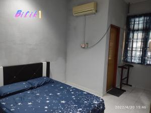 Postel nebo postele na pokoji v ubytování Yuna Homestay