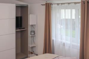 TV a/nebo společenská místnost v ubytování Ferienwohnung Melcher