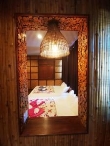 
A bed or beds in a room at Baan Sabai Maesai
