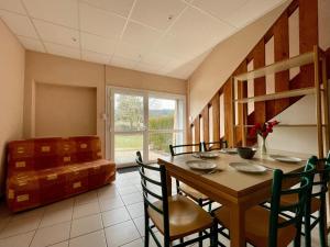 a dining room with a table and chairs and a window at Gîte Cayres, 3 pièces, 7 personnes - FR-1-582-341 in Cayres