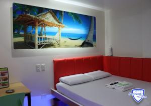 Postel nebo postele na pokoji v ubytování My Inn Cubao