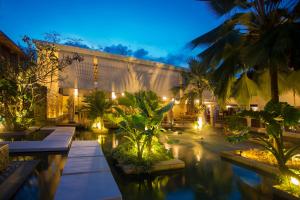 En hage utenfor Dhevatara Beach Hotel