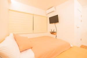 Postel nebo postele na pokoji v ubytování Huayuanhouse HQ in hongdae