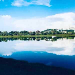 a large body of water with the sky and clouds at Grand Serene Lakeside Bali Style Villa in Cyberjaya