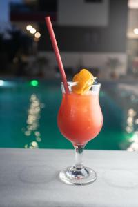 a drink in a glass sitting on a table at Aeonian Luxury Suites Asprovalta, Adults Only & Kids 12 Plus in Asprovalta