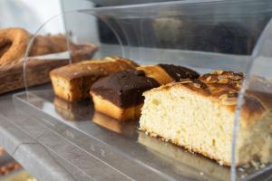 a bunch of different types of pastries in a plastic container at Aeonian Luxury Suites Asprovalta, Adults Only & Kids 12 Plus in Asprovalta