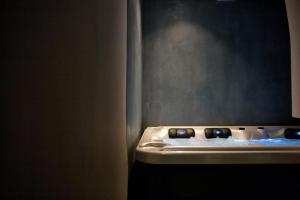 a kitchen with a stove with blue lights on it at Villa Galaxy Santorini in Fira