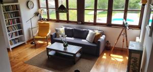 a living room with a couch and a coffee table at Refugio del Cares in Ortiguero