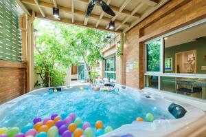 a large swimming pool with a lot of balls in it at Cozy House in Hua Hin, Thailand in Hua Hin