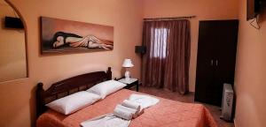 A bed or beds in a room at Porofarago