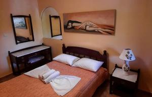 A bed or beds in a room at Porofarago