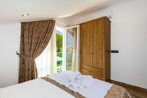 Giường trong phòng chung tại 4 Beds, Luxury Holiday Villa in Hisarönü Ölüdeniz Villa Mia +34 ảnh
