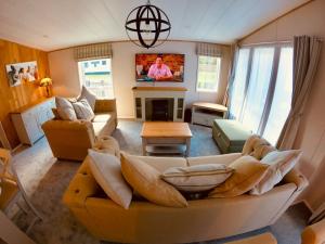 TV o dispositivi per l'intrattenimento presso Luxury Lodge - Hoburne Devon Bay