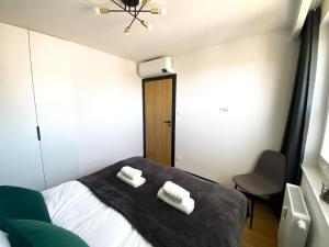 Posteľ alebo postele v izbe v ubytovaní ALEapartament