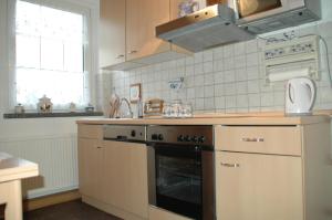 Kuchyň nebo kuchyňský kout v ubytování Ferienwohnung Sonnendeck Spreewald