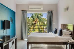 TV a/nebo společenská místnost v ubytování Arotel Rooms & Suites Calangute