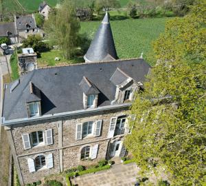 an aerial view of a house with a pointed roof at Le Manoir de la Bigotière in Pleslin-Trigavou