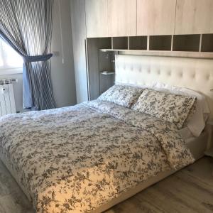 A bed or beds in a room at La Casa di Gio Golf Tennis e parcheggio privato