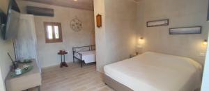 Posteľ alebo postele v izbe v ubytovaní Stavlos Country House