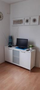 a white desk with a computer on top of it at Peace and quiet apartment in Brela, Croatia in Brela