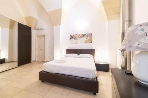 Posteľ alebo postele v izbe v ubytovaní Milestone Inn Lecce