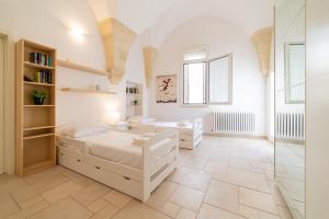 Posteľ alebo postele v izbe v ubytovaní Milestone Inn Lecce